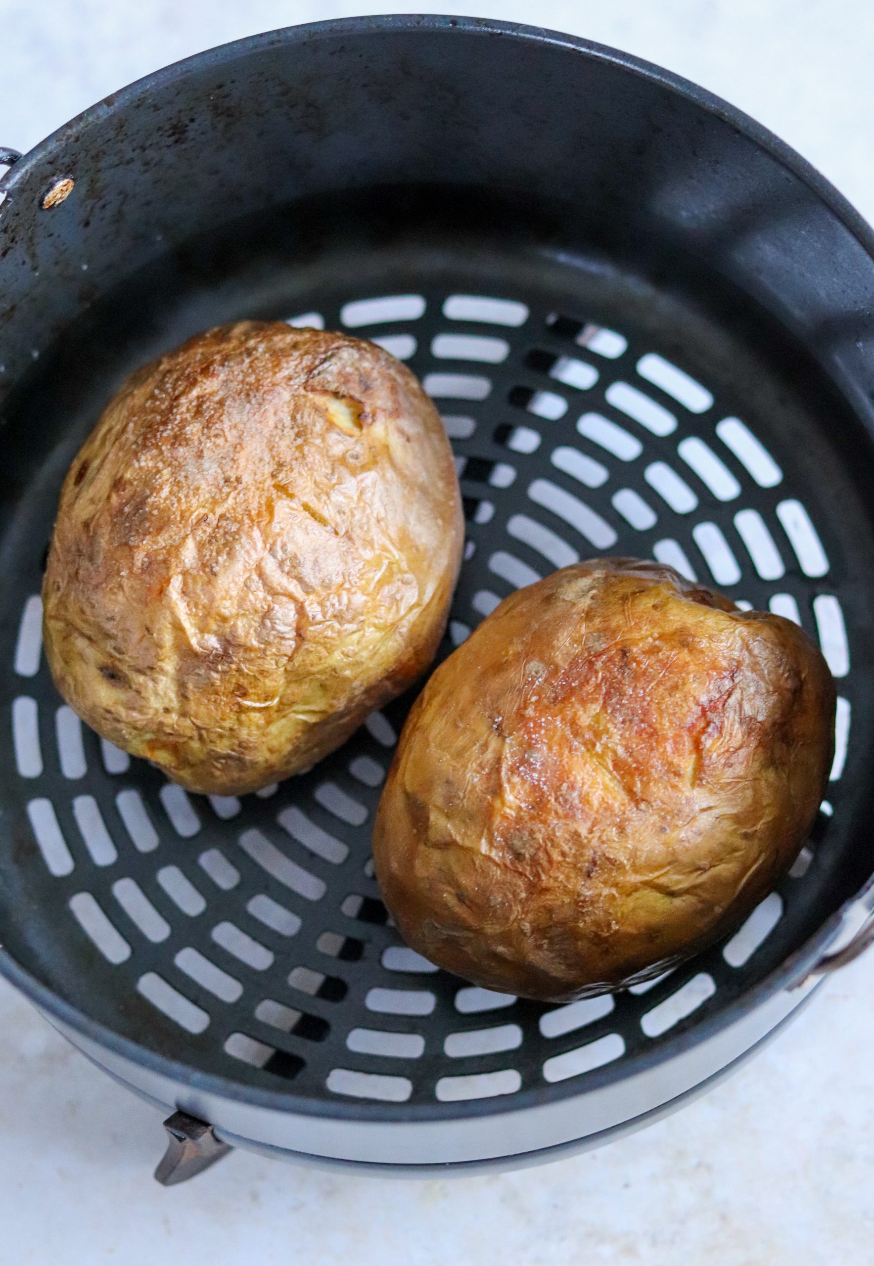 https://www.curlyscooking.co.uk/wp-content/uploads/2023/01/Air-Fryer-Baked-Potatoes-4-scaled.jpg